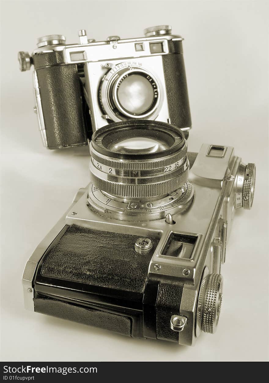 Two antiquarian 35-mm film cameras. Two antiquarian 35-mm film cameras.