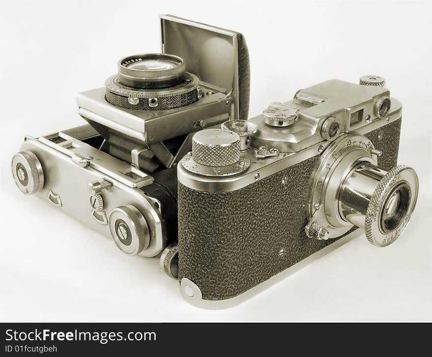 Two antiquarian 35-mm film cameras with put-forward lens. Two antiquarian 35-mm film cameras with put-forward lens.