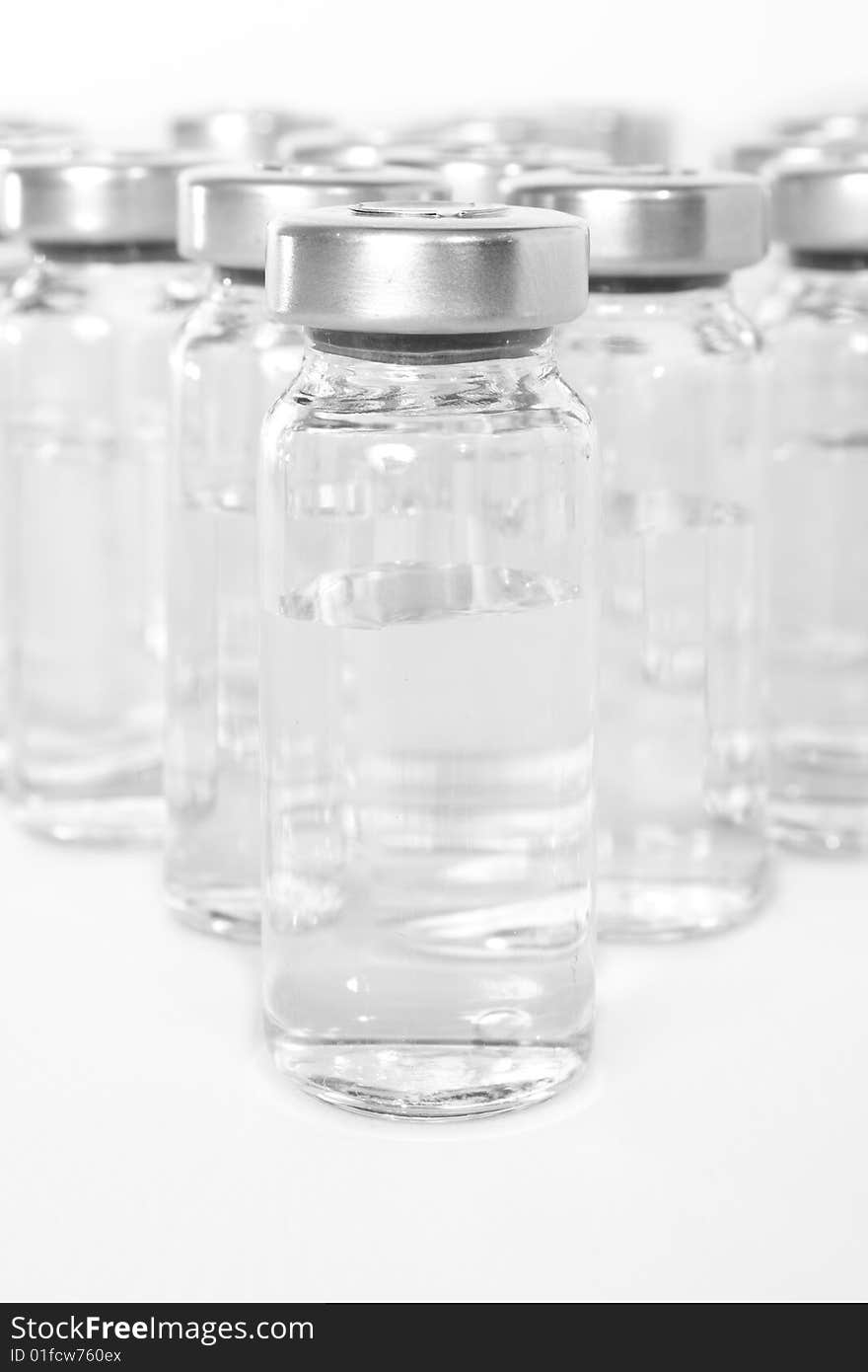 Bottles with a medical product, a transparent liquid