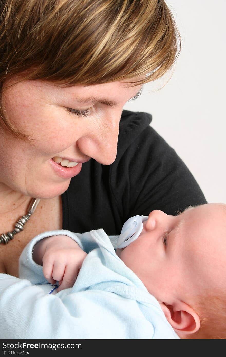 Loving mother holding her new baby boy. Loving mother holding her new baby boy