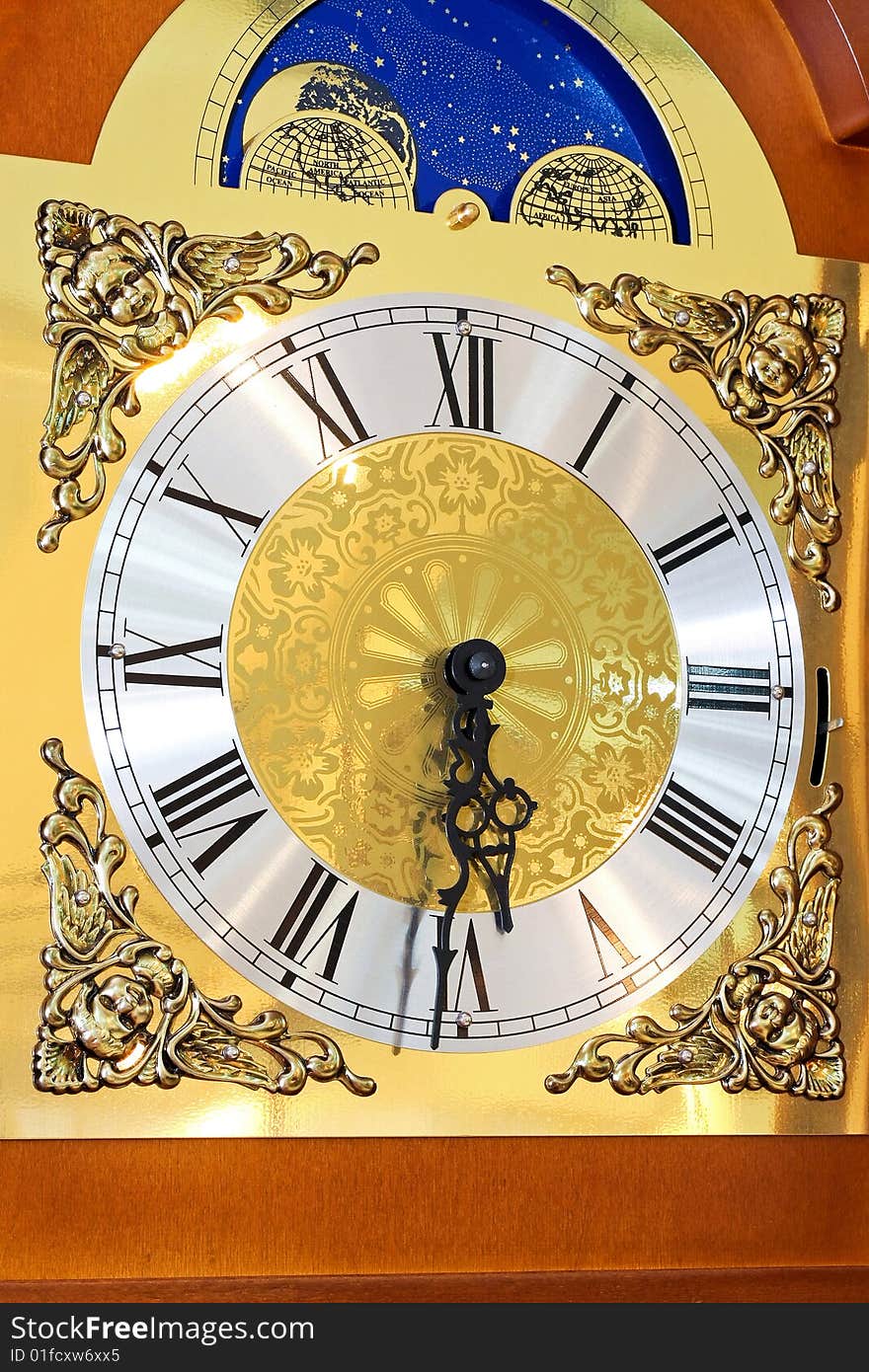 Close up shot of clock dial in gold