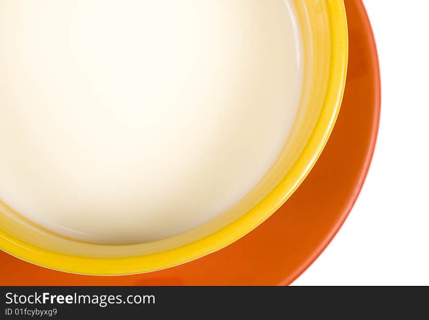 Cup of milk (detail) on white background