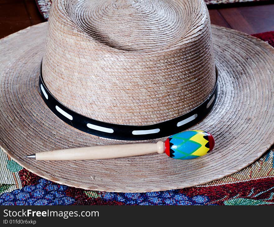 A native hat and a pen. A native hat and a pen