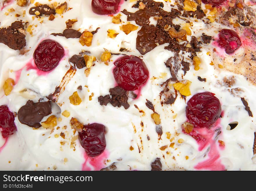 Birthday cream cake with cherries and chocolate close-up