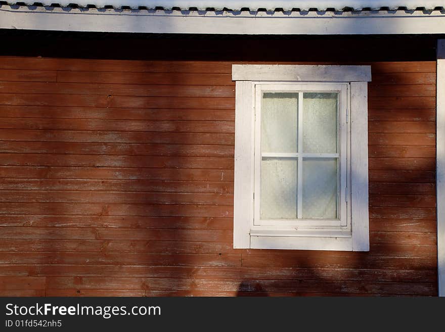 Window in red wooden wall, can be used for copy text. Window in red wooden wall, can be used for copy text