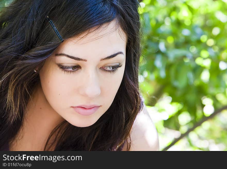 Young woman portrait staring to the right side.