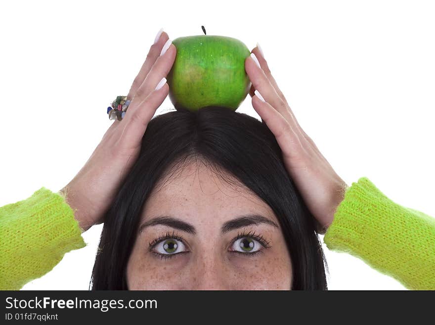 Young woman holding healthy green apple above the head isolated on white background