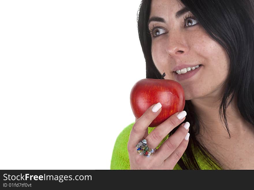 Young woman holding healthy red apple in the hands isolated on white background