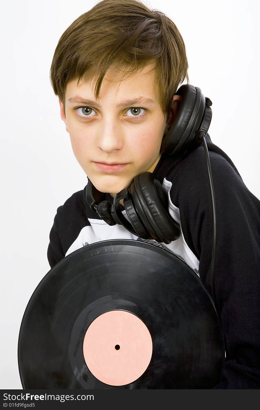 Young man with headphones and viyil plate. Young man with headphones and viyil plate