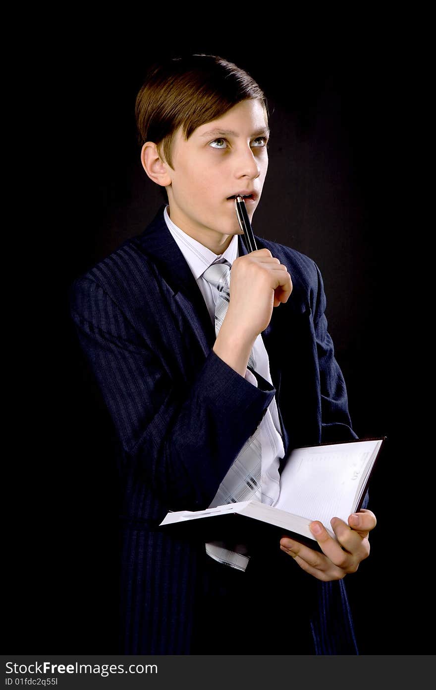 Young businessmen in suit and tie with notebook and pen