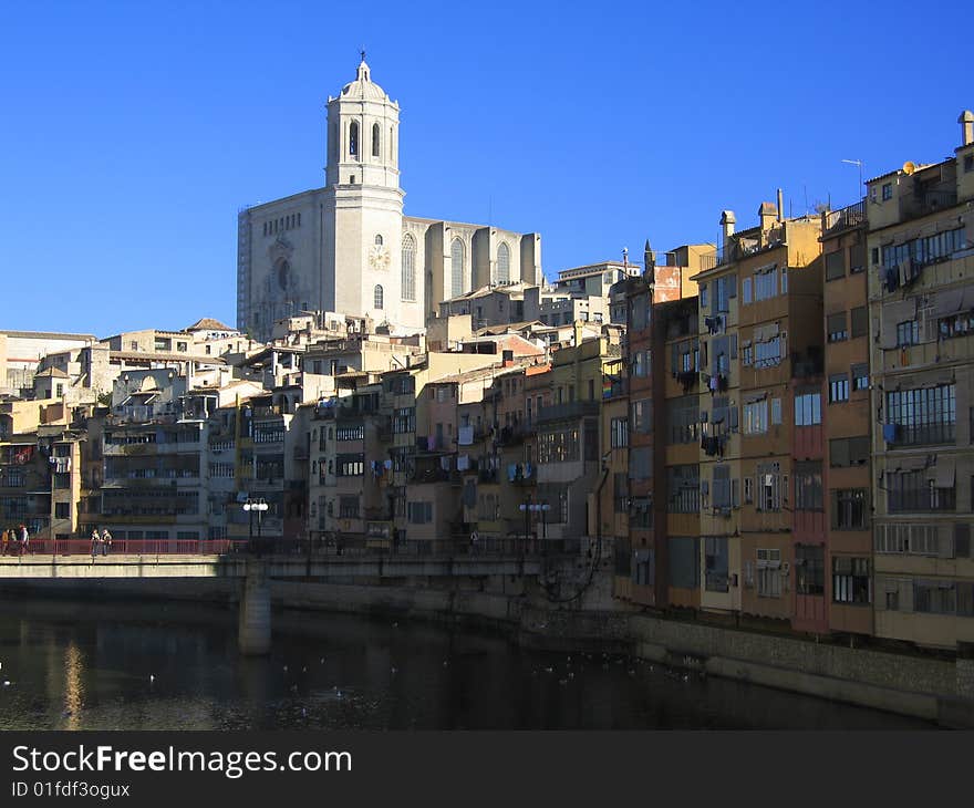 Girona tower above other houses with the river. Girona tower above other houses with the river