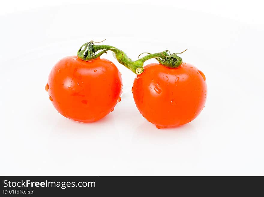 Pair of tomatoes joined by vine