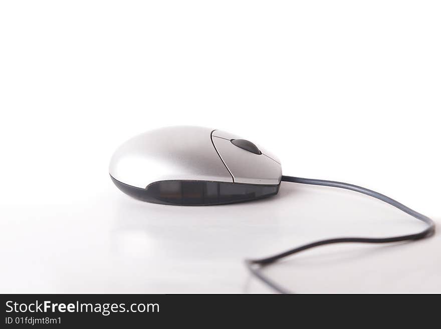 Computer mouse with cable on white background. Isolated over white.