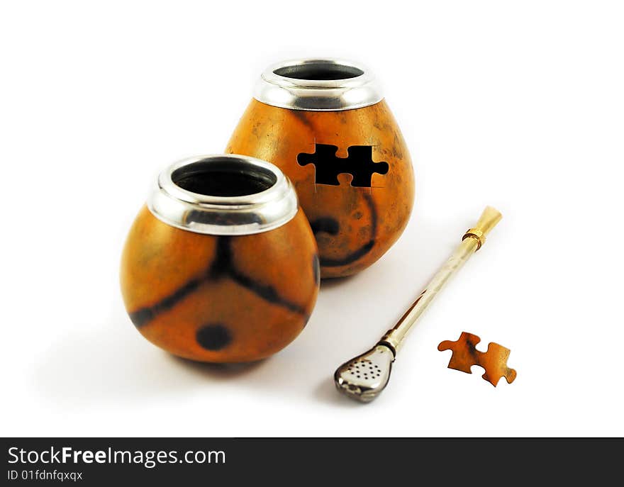 Two yerba mate gourds with missing puzzle element isolated on white