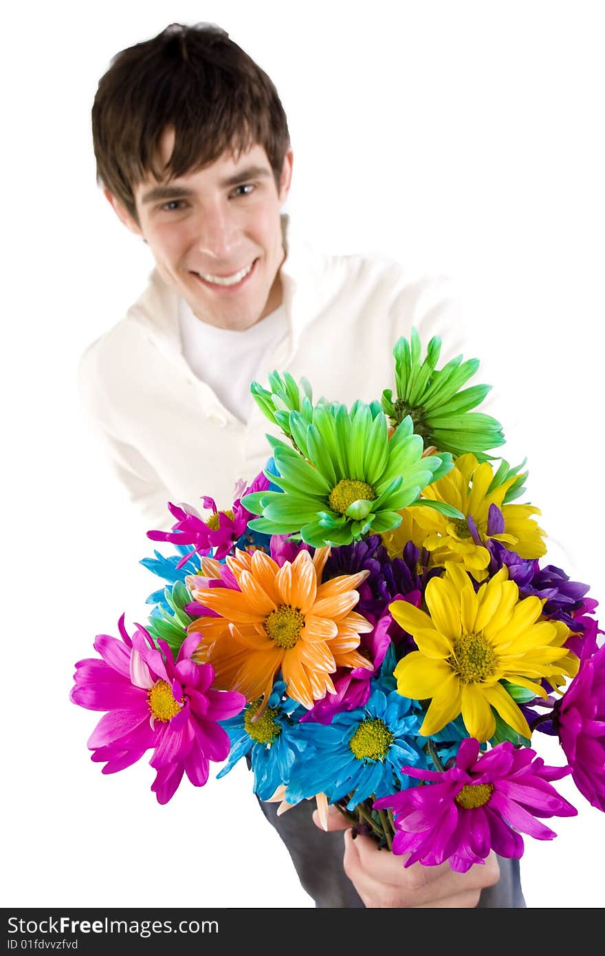 A young man holds a rose and smiles