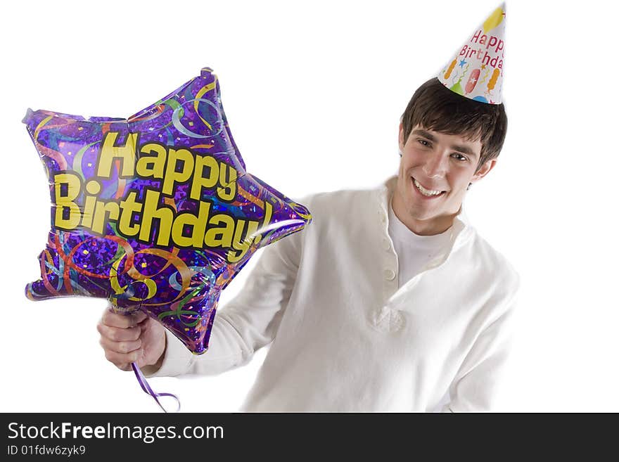 Young man holding birthday balloon