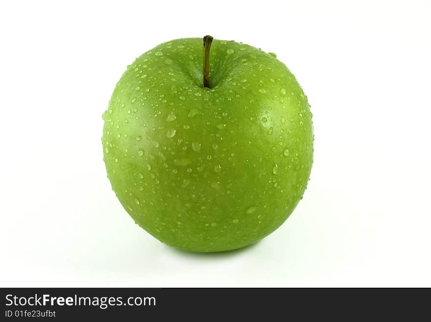 Green apple with water droplets on
white background. Green apple with water droplets on
white background