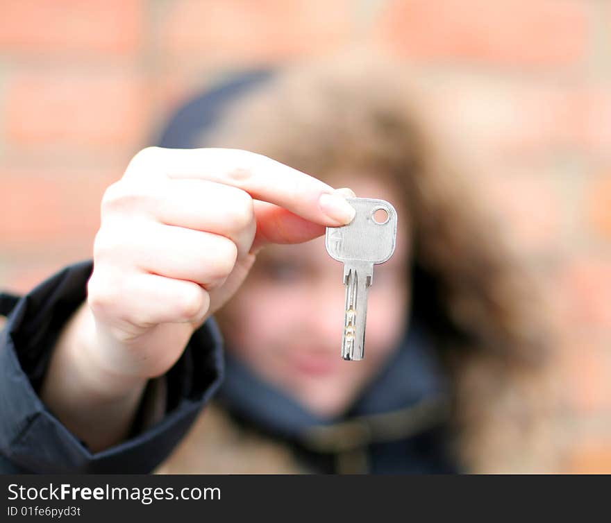 Hand holds a key (key in focus). Hand holds a key (key in focus)