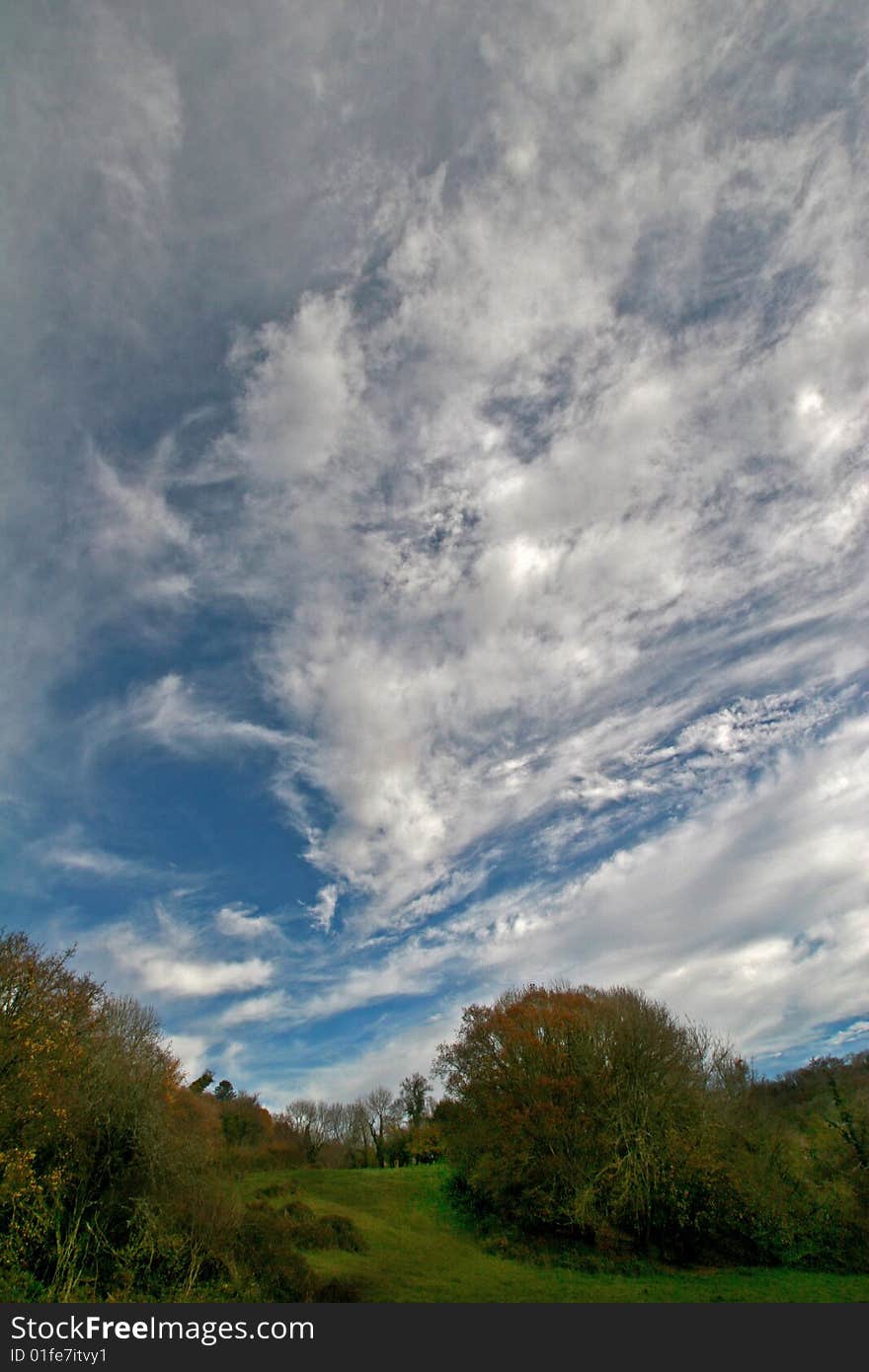 Cumulus clouds over field in autumn. Cumulus clouds over field in autumn