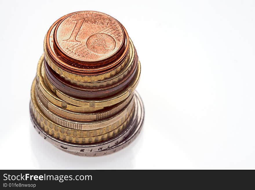 A selection of euro coins on a white background