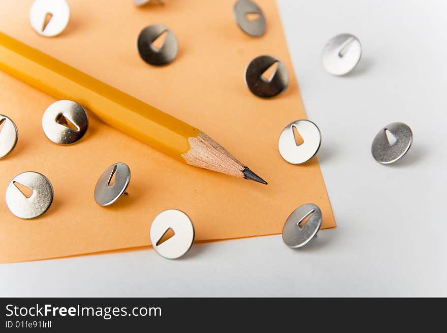 A photo of a yellow pencil with knobs