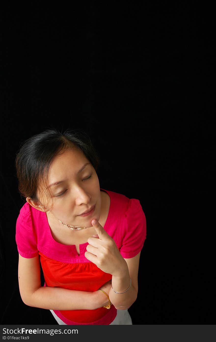 Chinese lady thinking on black background