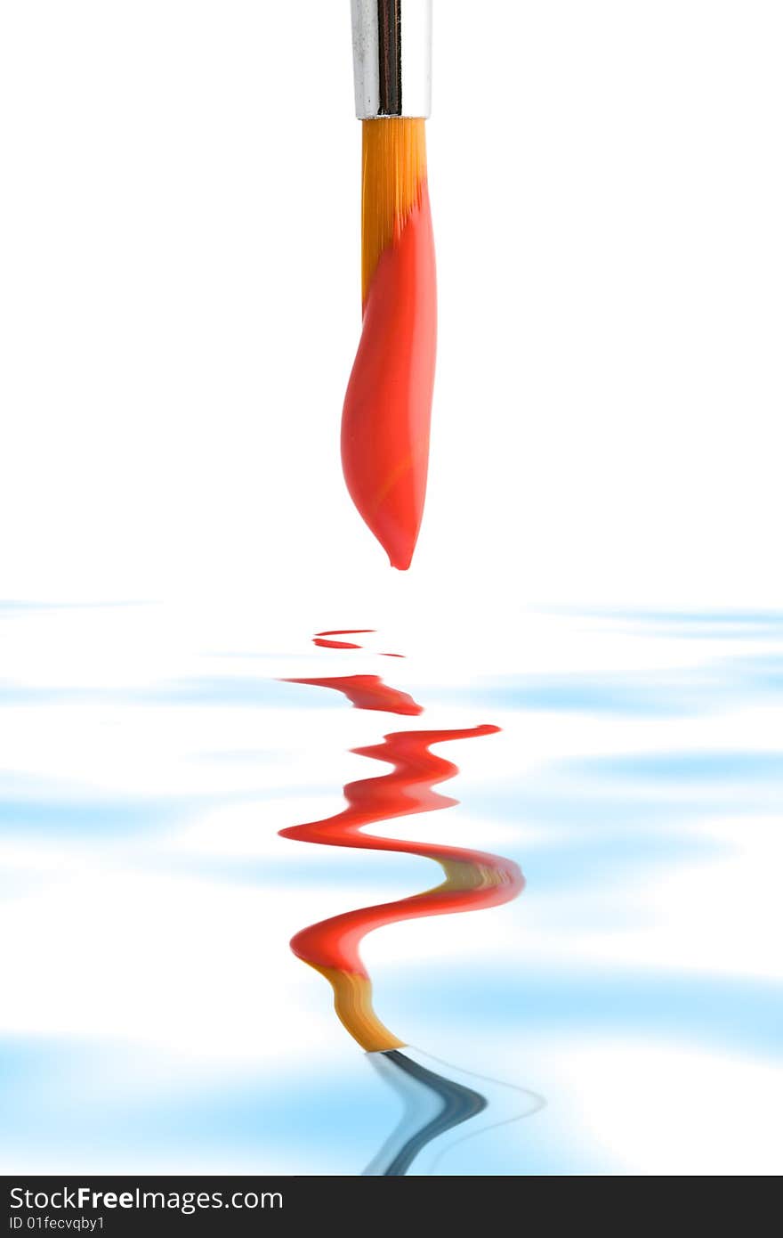 Stock photo: an image of a brush with red paint on it