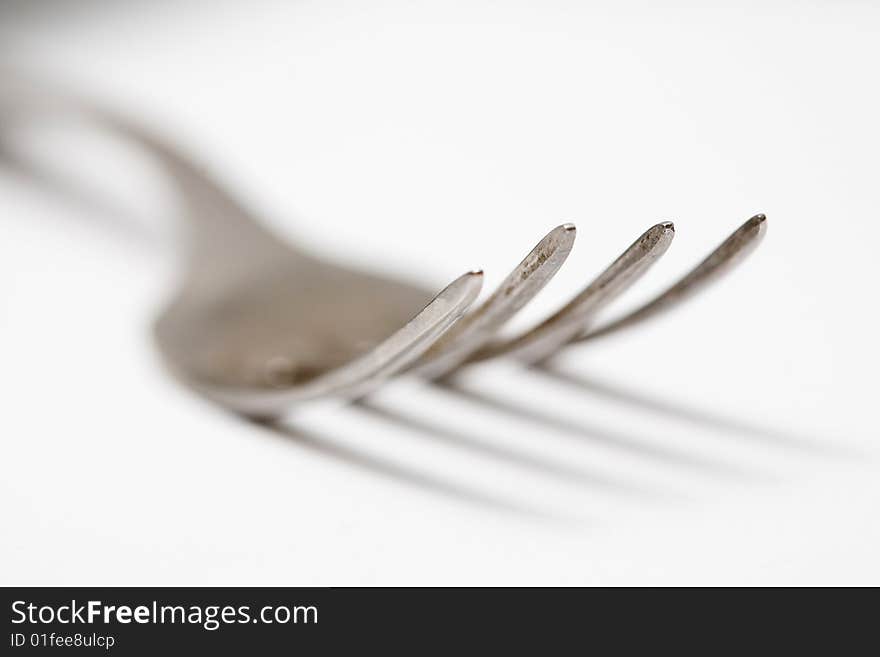 Stock photo: food theme: an image of big steel fork closeup