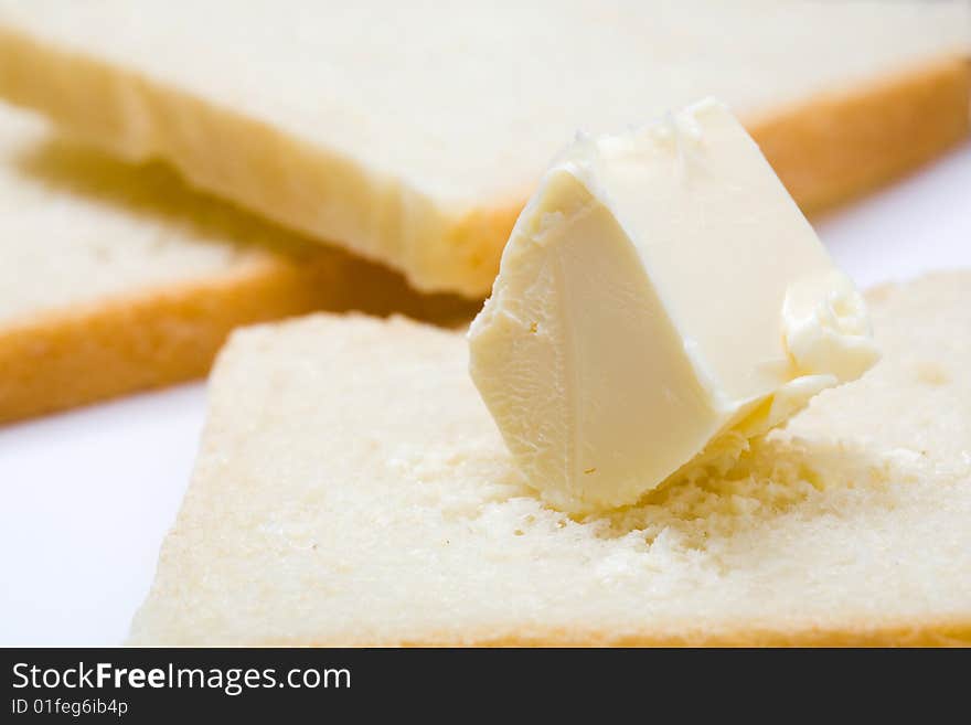 Stock photo: an image of fresh butter on a slice of bread. Stock photo: an image of fresh butter on a slice of bread