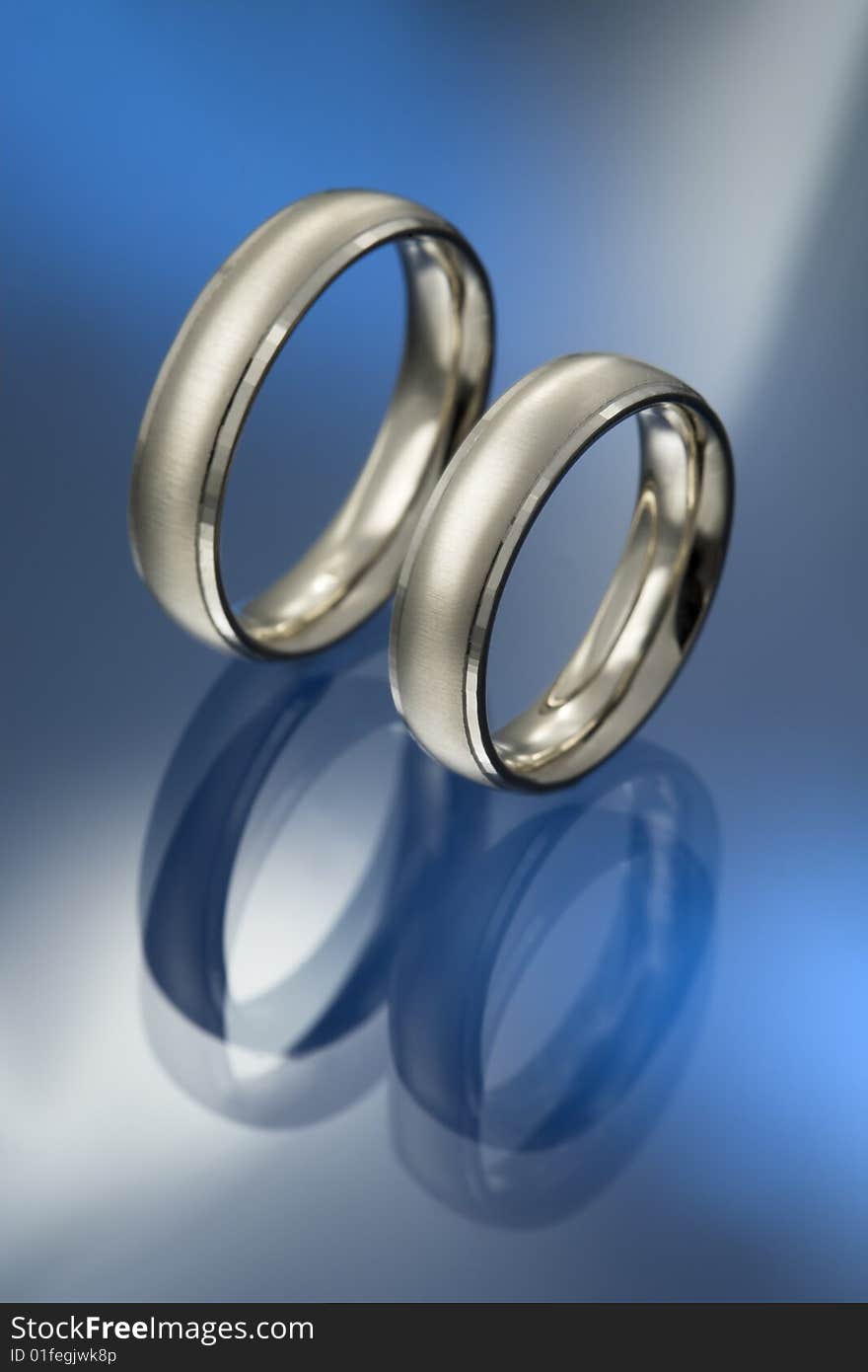 A pair of white gold wedding rings. A pair of white gold wedding rings