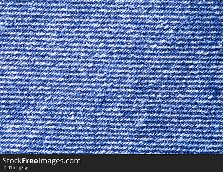 A close-up of the texture of blue jeans fabric. A close-up of the texture of blue jeans fabric