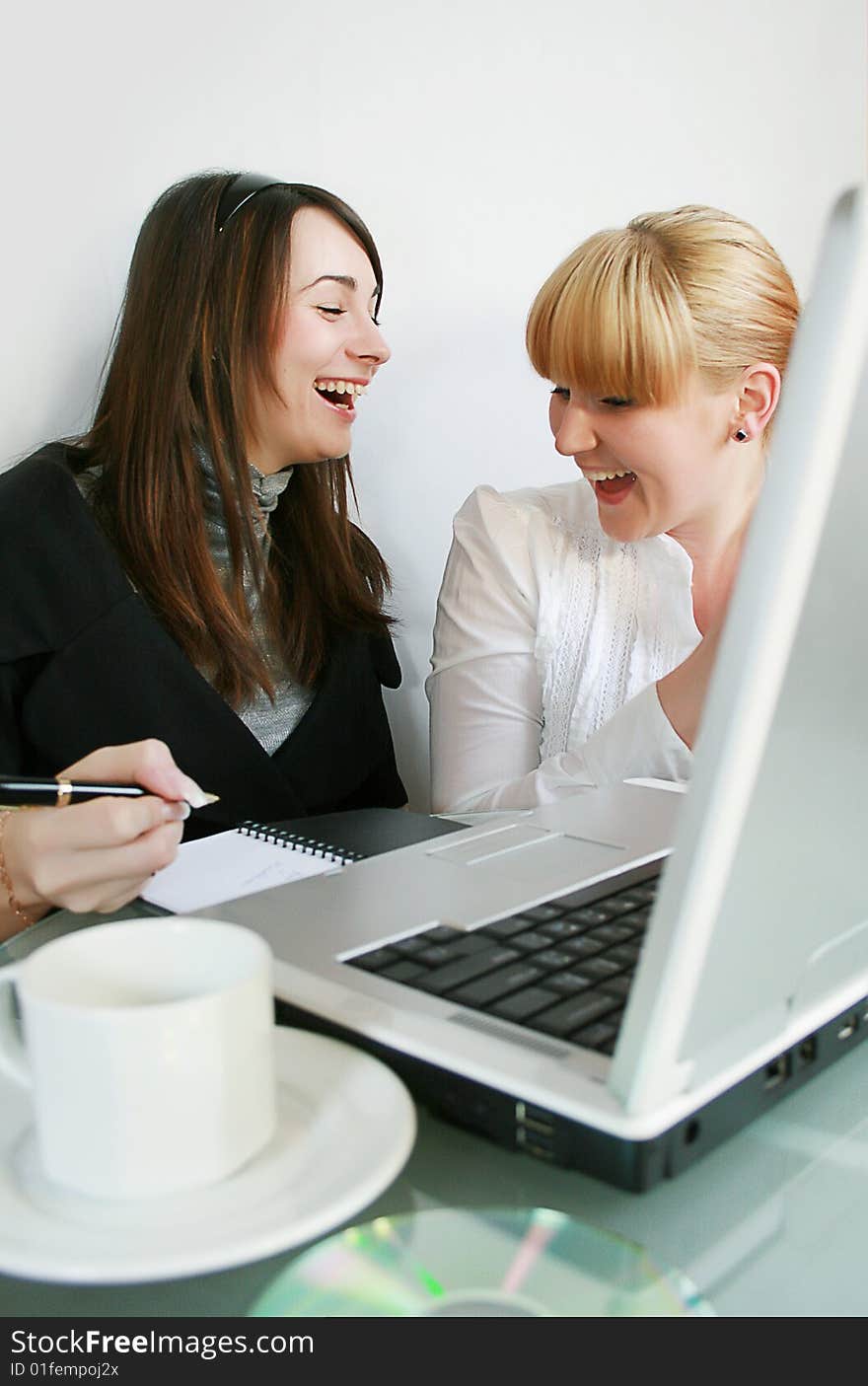 Two young business partners working in office. Two young business partners working in office.