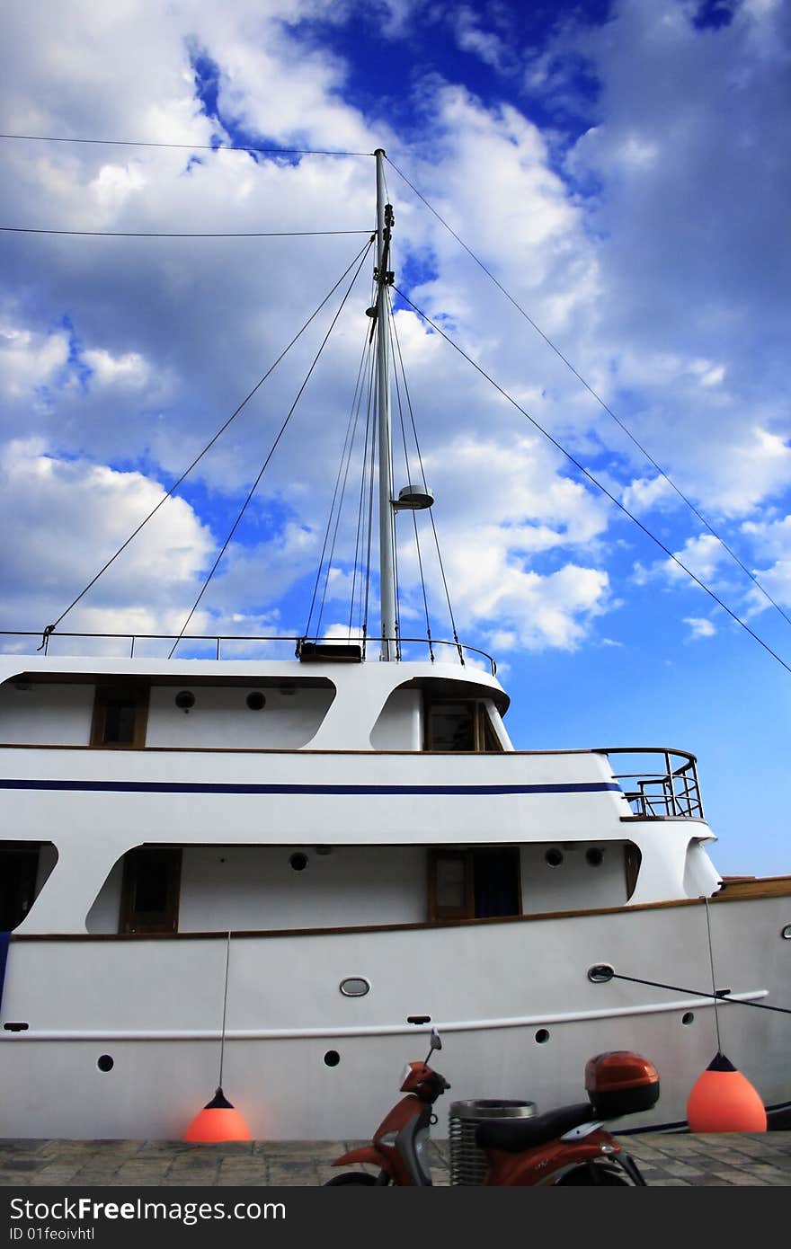 A big white yacht before the clouds