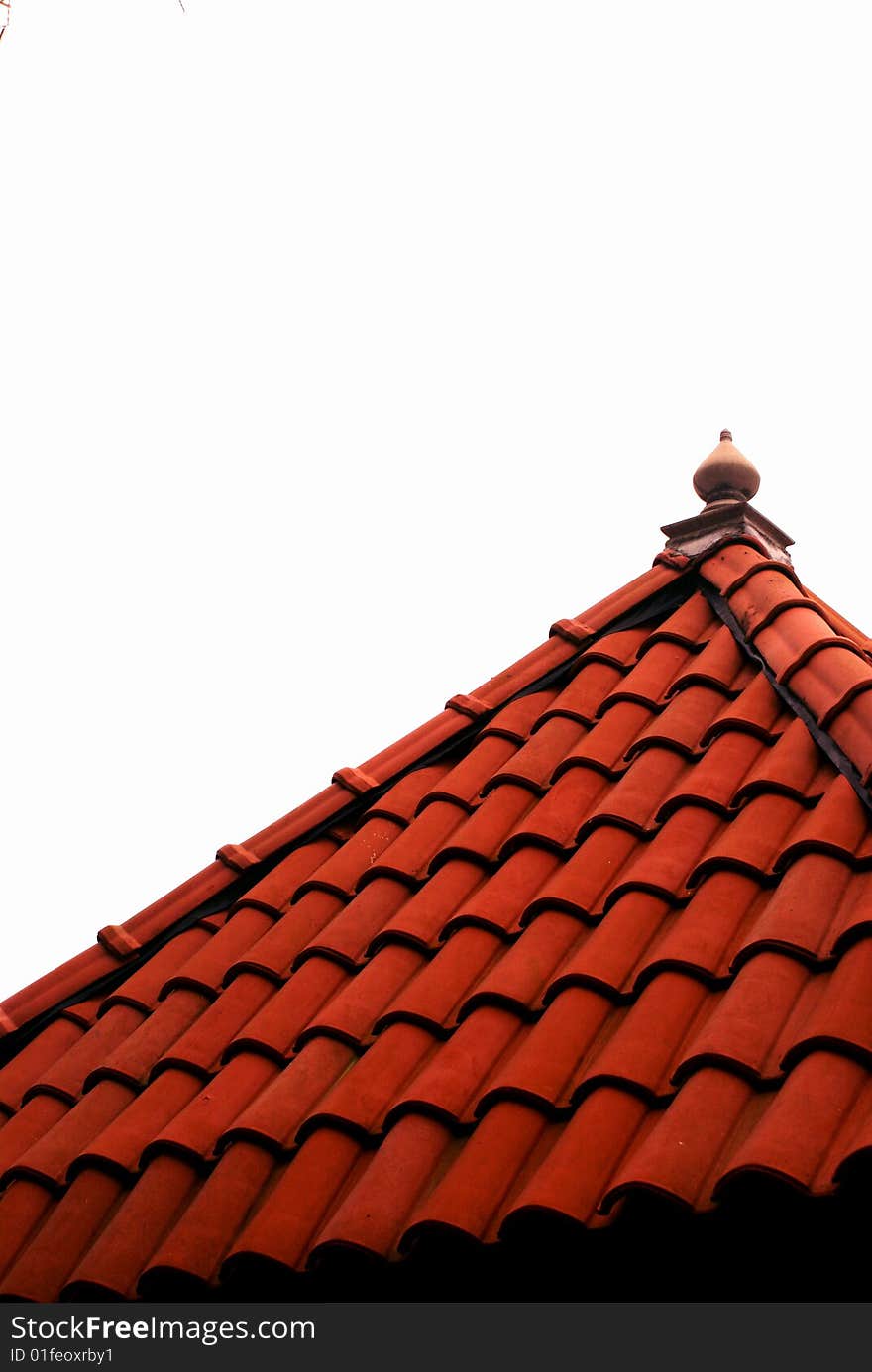 A ceramic tiled rooftop of a gazebo infront of a white background