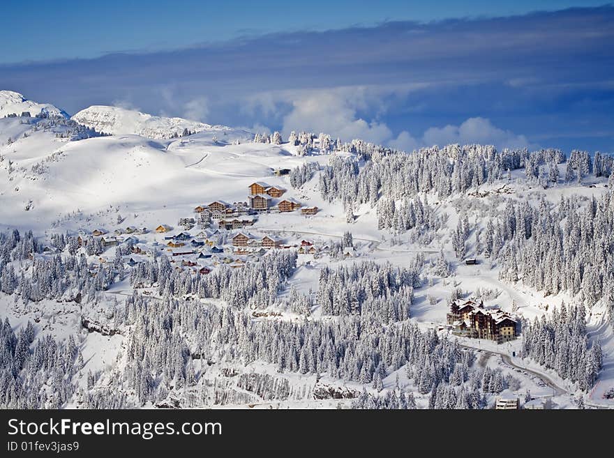 Snow Covered Mountain Side With Buildings