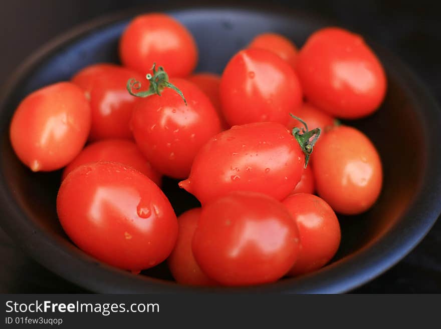 Tomatoes isolated on black background