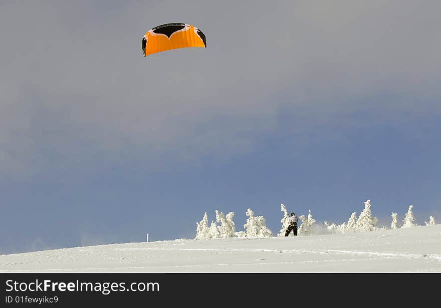 Snowbording with parachute