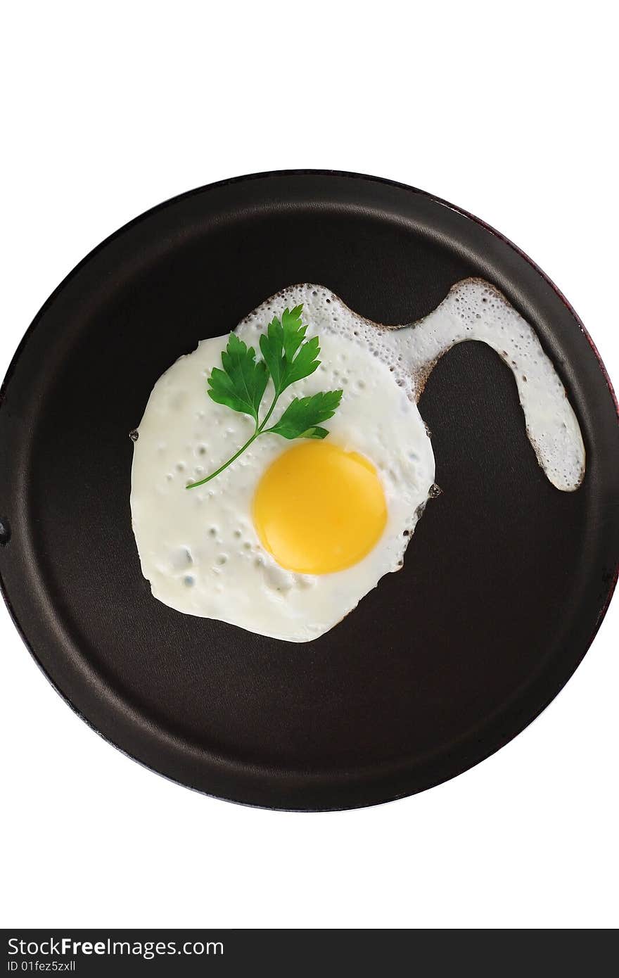 Egg with yolk and parsley bunch