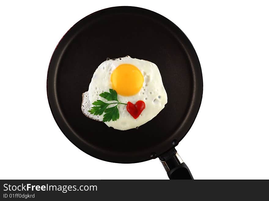 Fryed egg with ketchup and parsley