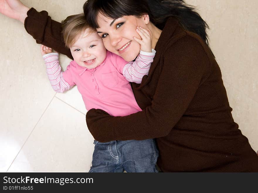 Happy family playing on floor. Happy family playing on floor