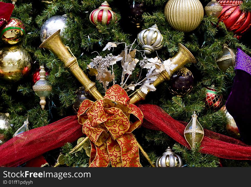 Christmas tree with nice decorations including horns and ribbons. Christmas tree with nice decorations including horns and ribbons