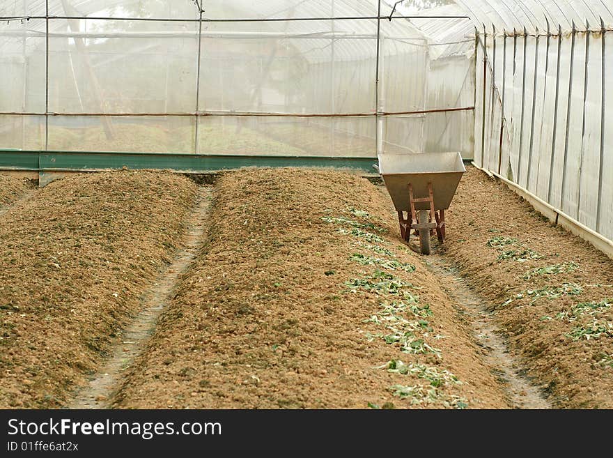 Farm and wheel barrow