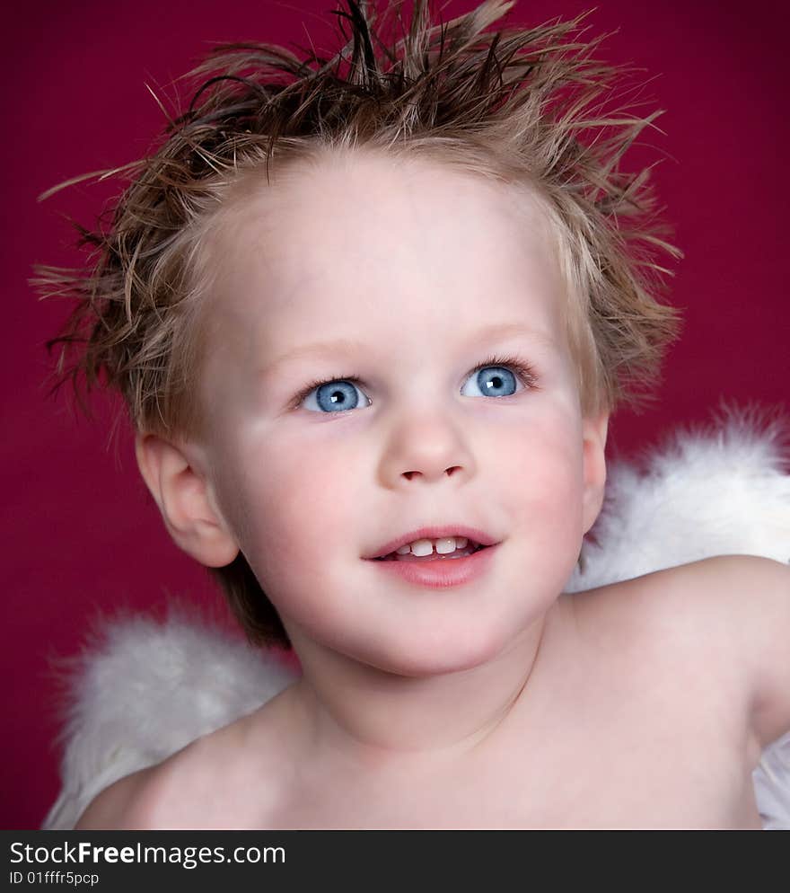 Close up of Angel Boy with beautiful blue eyes. Close up of Angel Boy with beautiful blue eyes