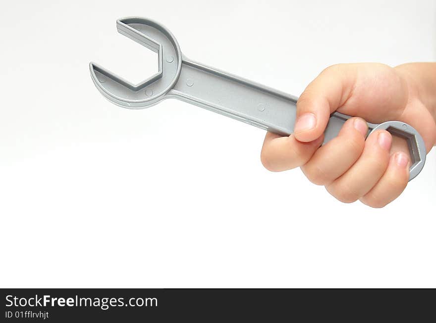 Spanner in hand on white background. photo image. Spanner in hand on white background. photo image