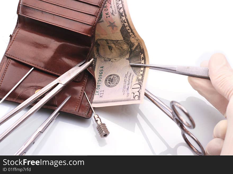 Surgical tools, purse and money. Surgical tools, purse and money