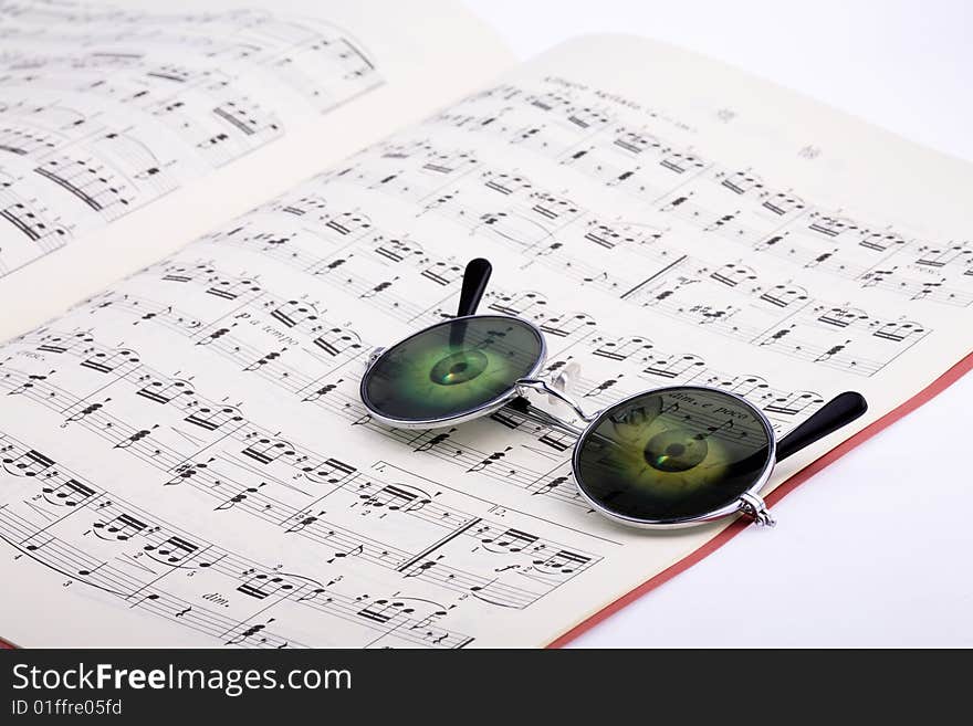 Glasses with music notes background
