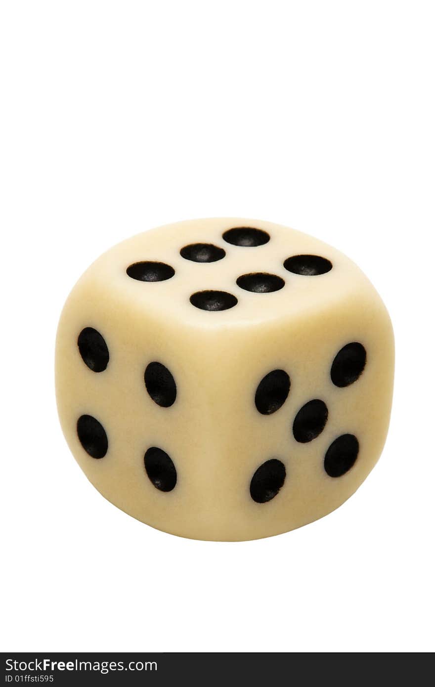 Old playing die on a white background