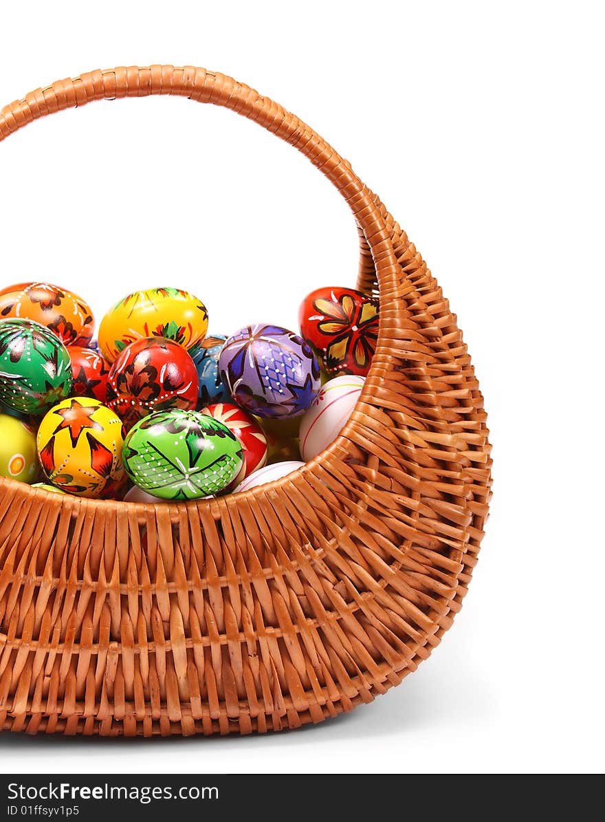 Couple of colorful Easter Eggs in a yellow basket. Couple of colorful Easter Eggs in a yellow basket.