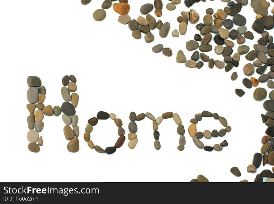 The word home written using volcanic stones from the black sea. Isolated on white. The word home written using volcanic stones from the black sea. Isolated on white.