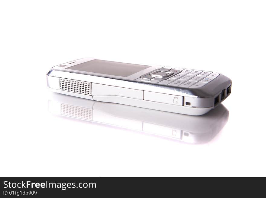 Isolated shot of a white cell phone. The phone is mirrored and isolated over pure white. Lot of copyspace. Isolated shot of a white cell phone. The phone is mirrored and isolated over pure white. Lot of copyspace.